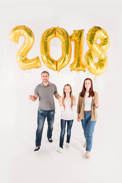 family with balloons for new year