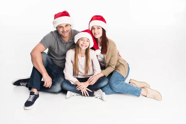 家庭在圣诞老人的帽子 — 图库照片