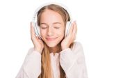 teenager listening music with headphones