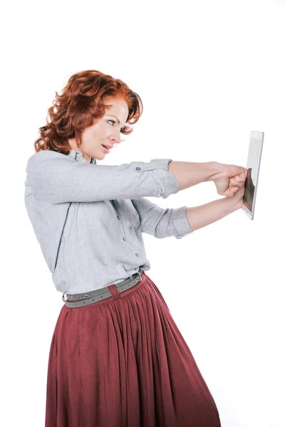 Woman punching digital tablet — Free Stock Photo