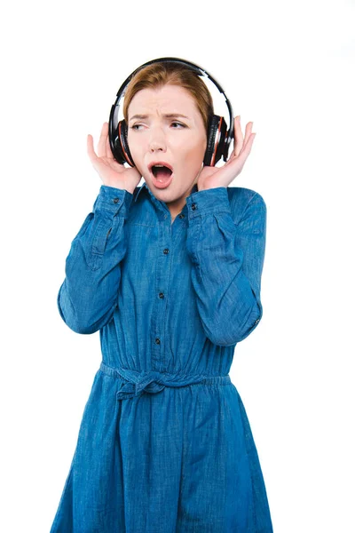 Shocked girl with headphones — Free Stock Photo