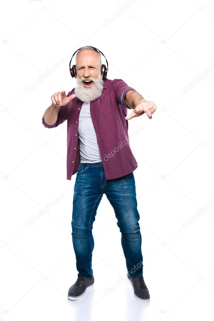 man singing and dancing with headphones