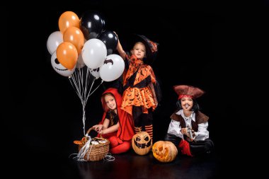 children with halloween balloons clipart
