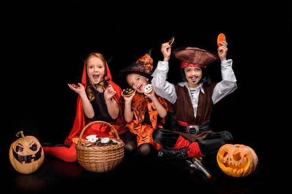 Devil, witch and pirate with sweets — Stock Photo, Image