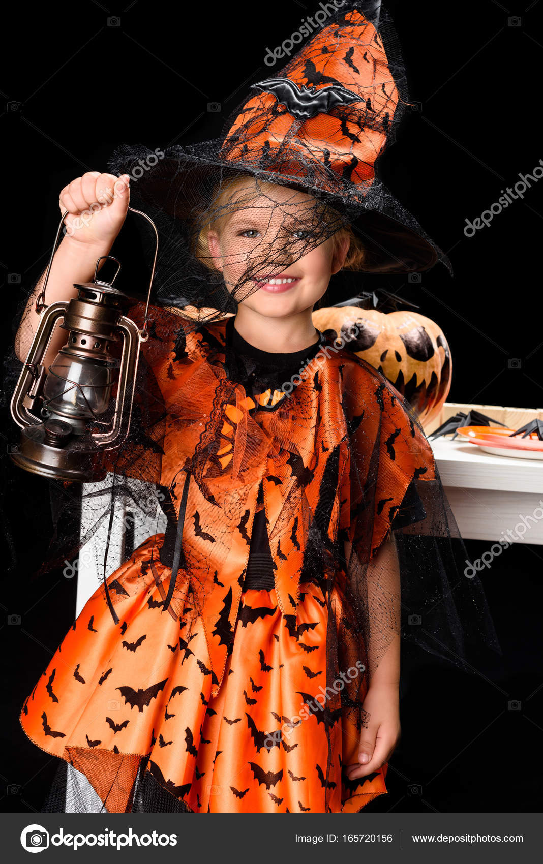 Child in costume of witch — Free Stock Photo © IgorVetushko #165720156