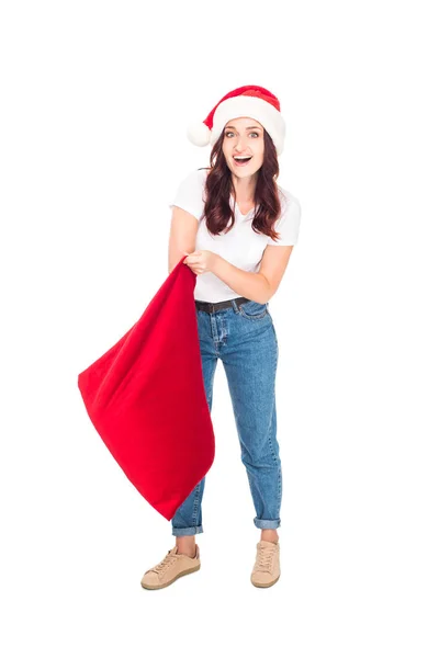 Girl in Santa hat with bag — Free Stock Photo