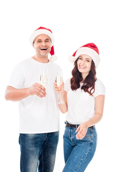 Pár v Santa klobouky s champagne — Stock fotografie