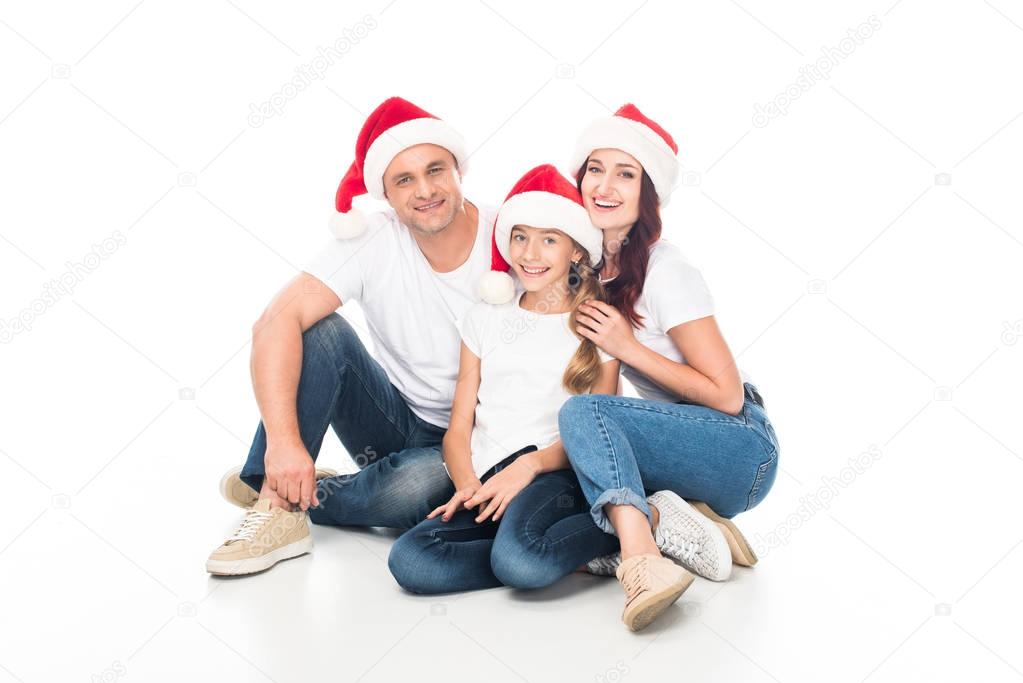 smiling family in Santa hats