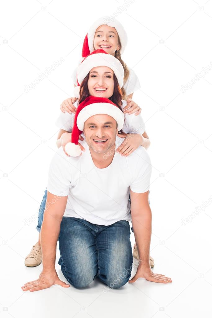 Happy family in Santa hats