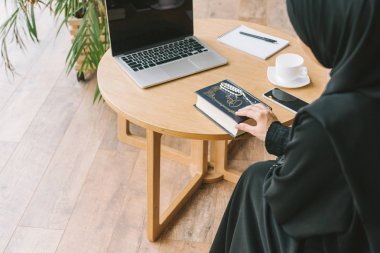 muslim woman with quran book clipart