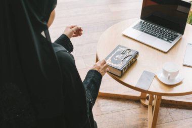 muslim woman with quran book clipart