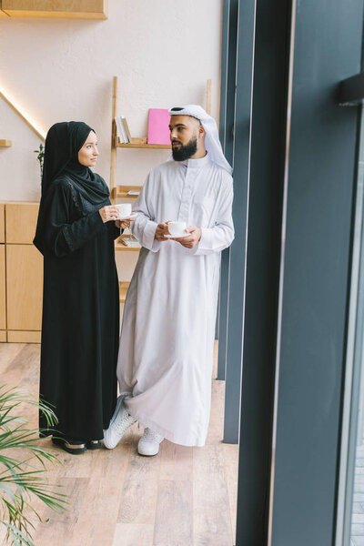 muslim couple drinking coffee