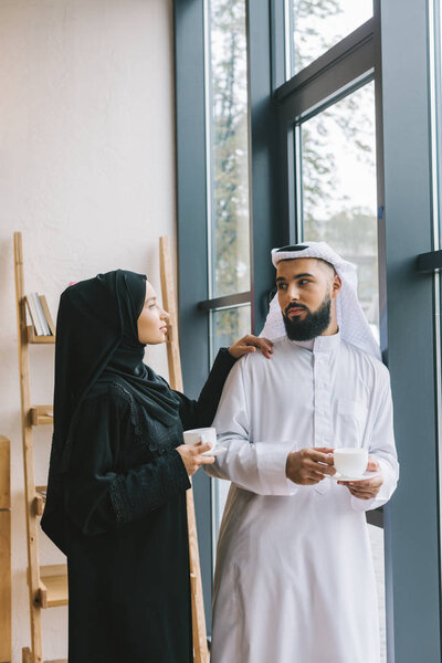 muslim couple drinking coffee