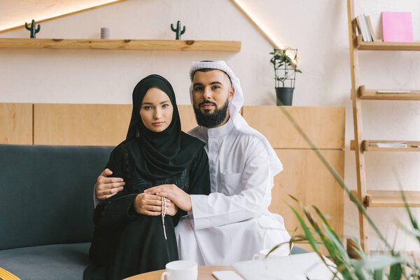 muslim couple embracing