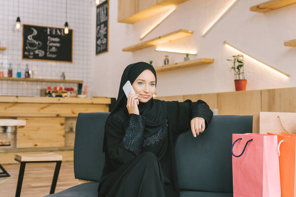 muslim woman talking by phone