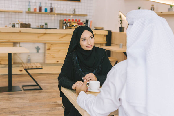 muslim couple having date in cafe