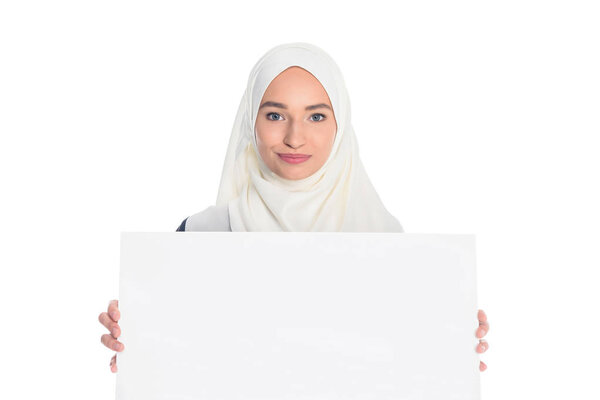 muslim woman holding blank board