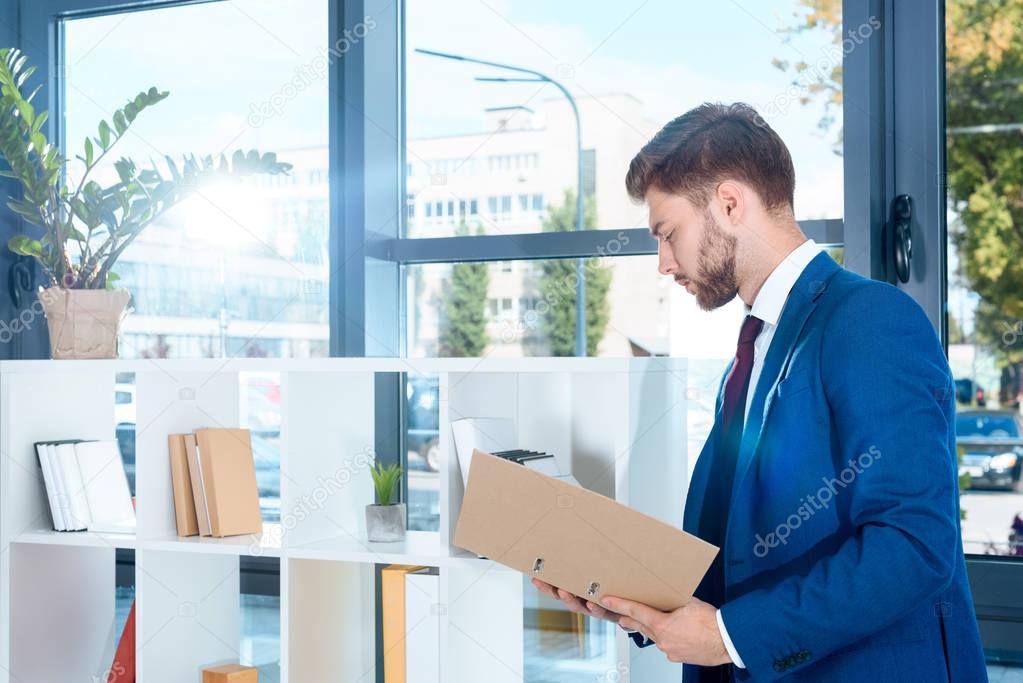 businessman holding folder