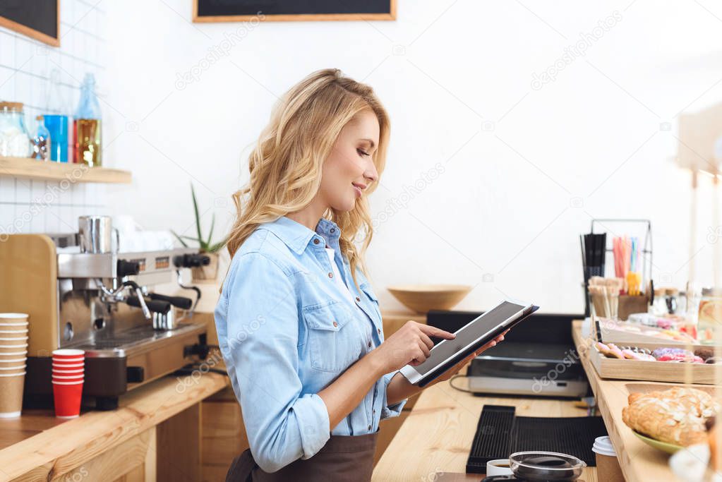 waitress using digital tablet