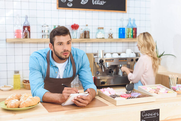 couple working together in cafe