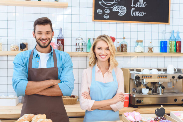 confident young cafe workers