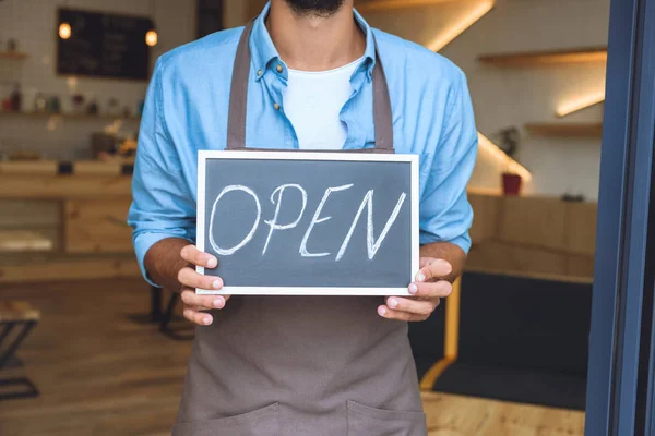 Cafe owner with sign open — Stock Photo, Image