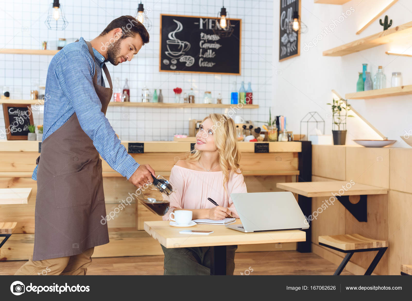 Waiter pouring coffee to client Stock Photo by ©IgorVetushko 167062626