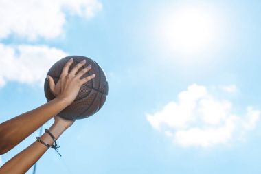 female hands holding basketball clipart