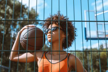 african-american woman holding basketball clipart