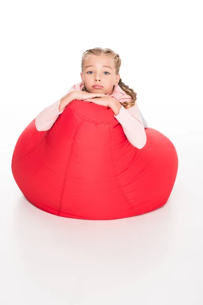 Dissatisfied child on bean bag — Stock Photo, Image