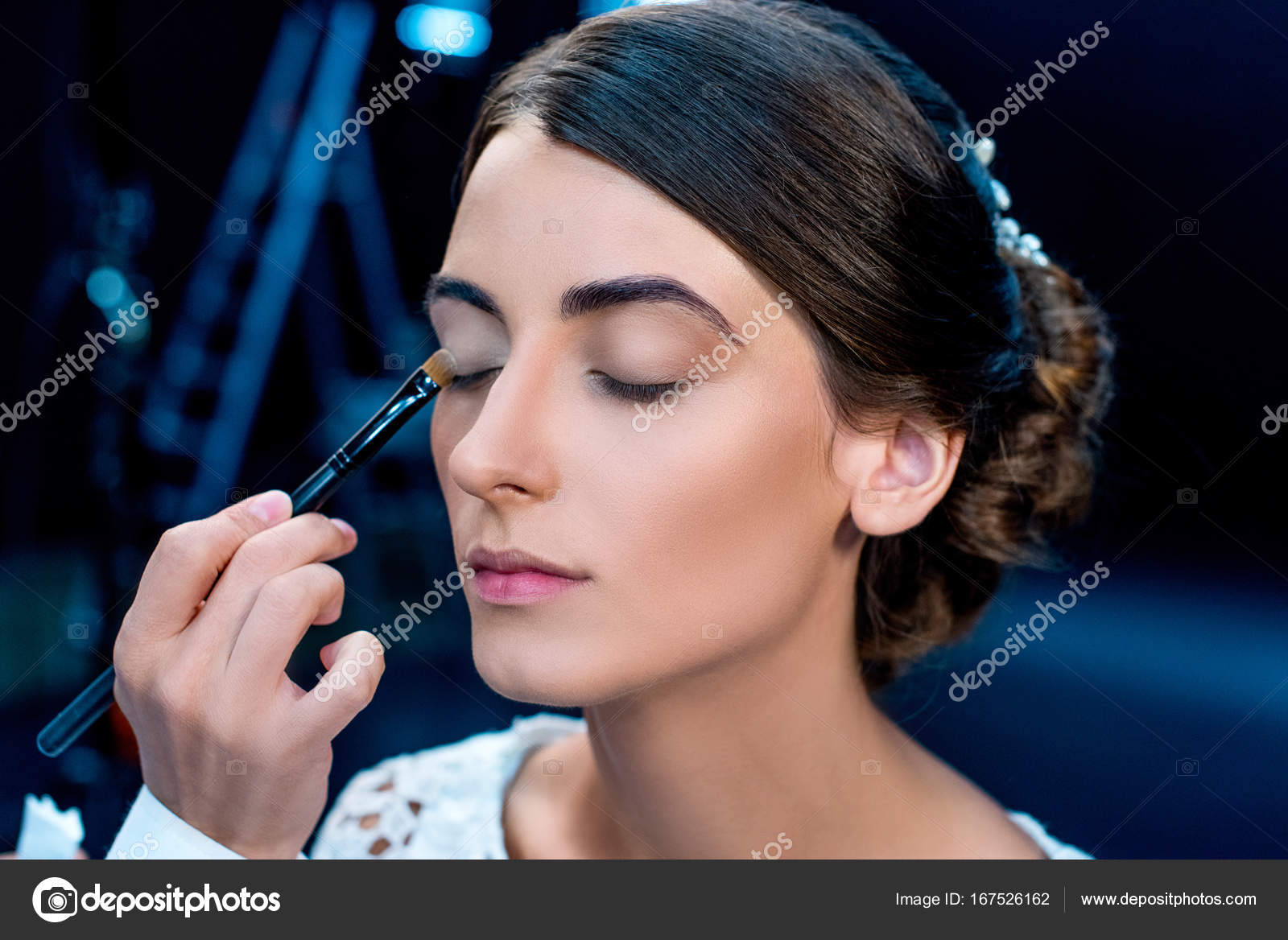 Makeup artist applying eye shadows — Free Stock Photo © IgorVetushko ...