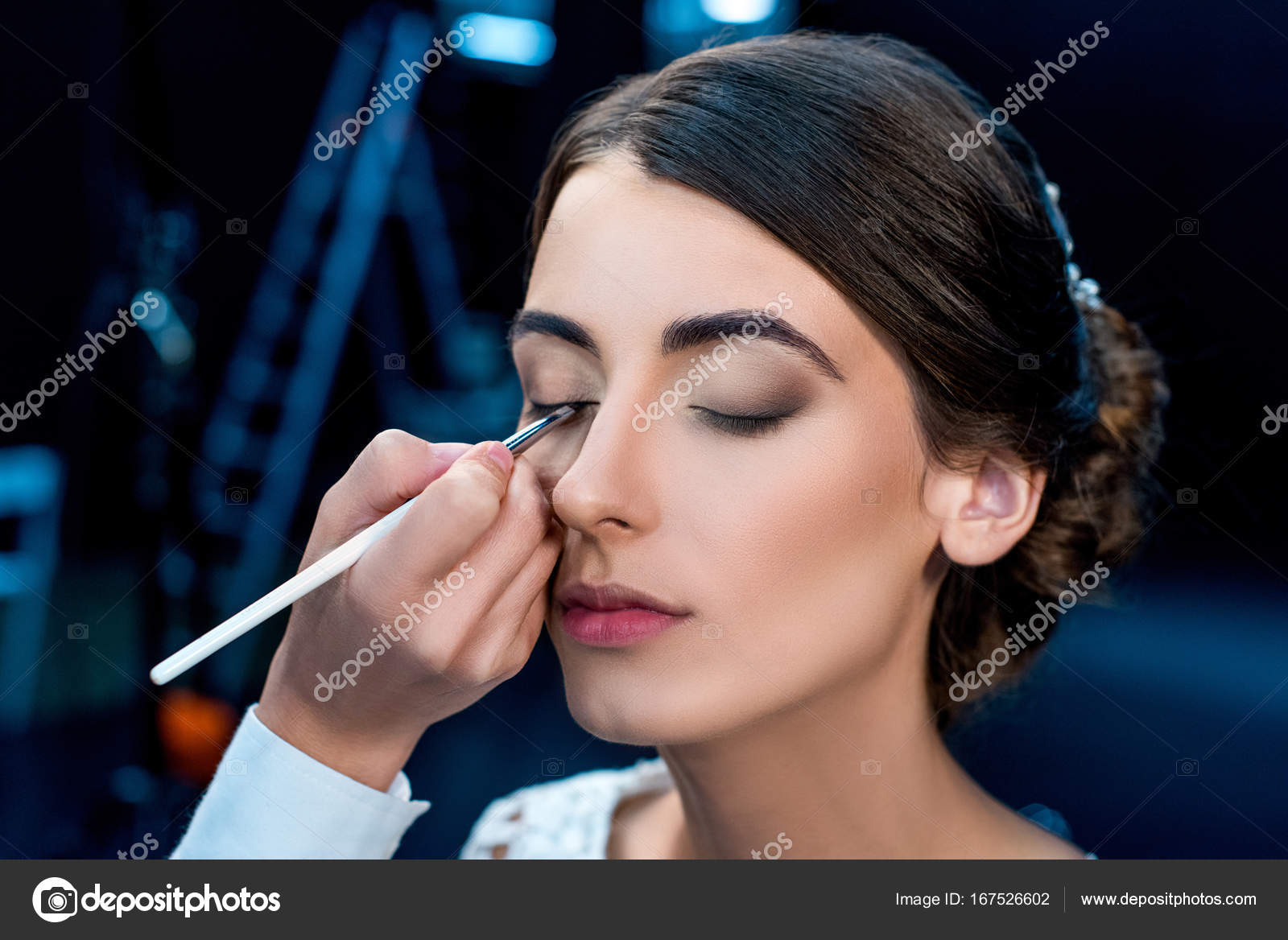 Woman getting makeup done Stock Photo by ©IgorVetushko 167526602