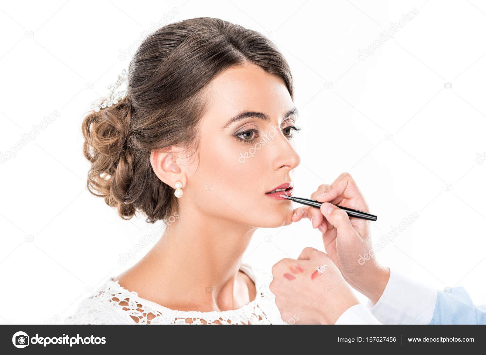 Makeup artist applying lipstick on model — Stock Photo © IgorVetushko