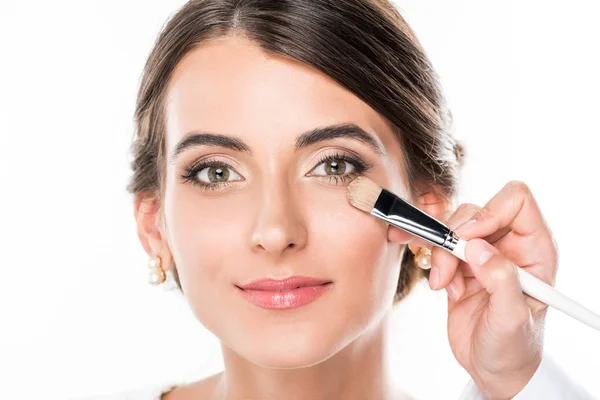 Makeup artist applying concealer — Stock Photo, Image