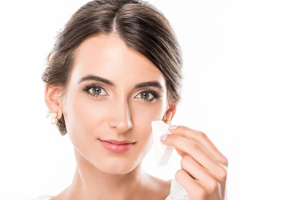 Woman with makeup sponge in hand — Stock Photo, Image