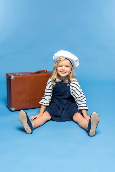 child with suitcase