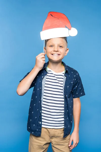 Boy with paper santa hat — Stock Photo, Image