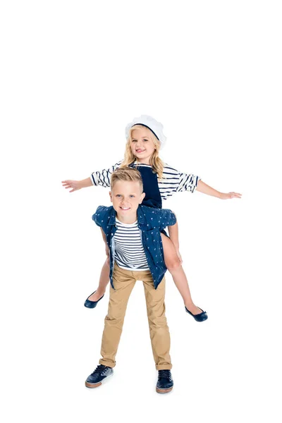 Boy piggybacking sister — Stock Photo, Image