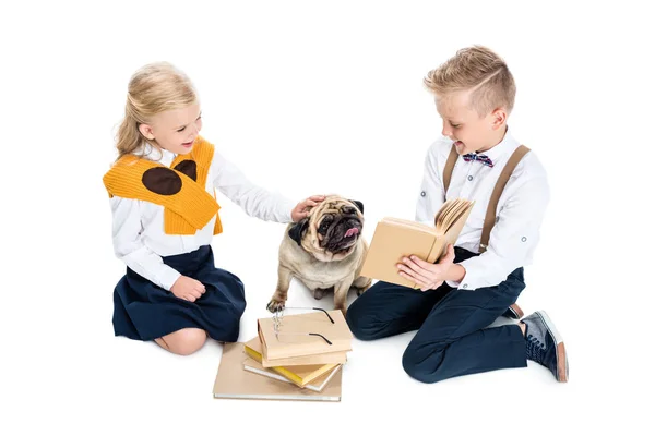 Kids with books and dog — Stock Photo, Image