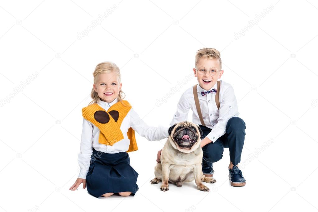 children stroking dog