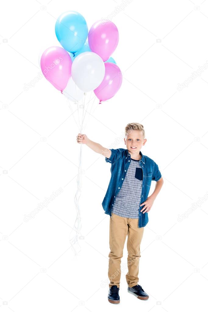 boy holding balloons