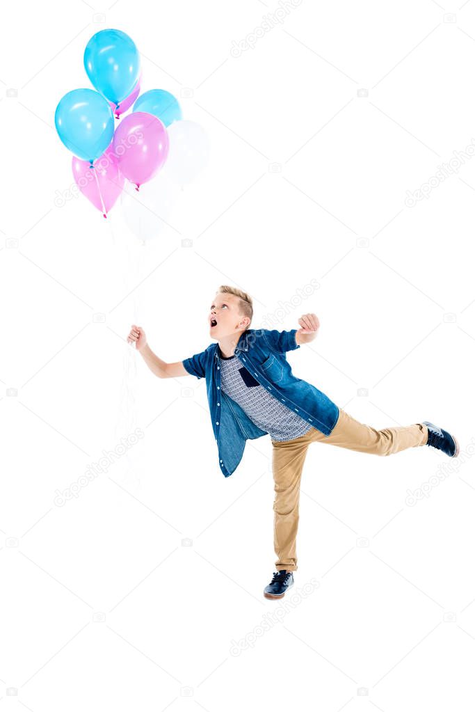 boy holding balloons