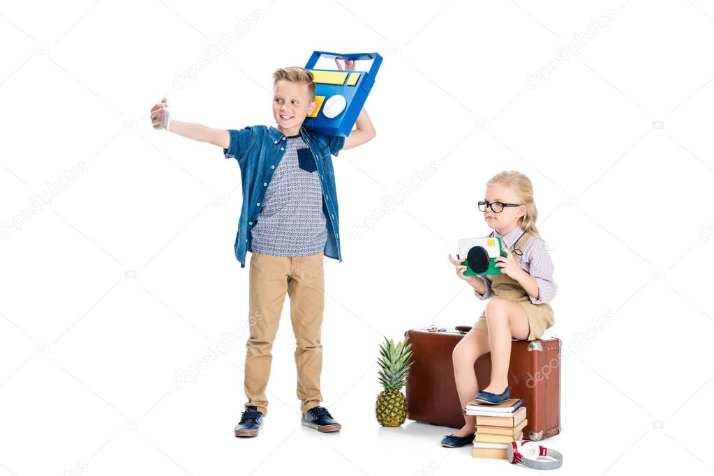 kids taking selfie with various objects