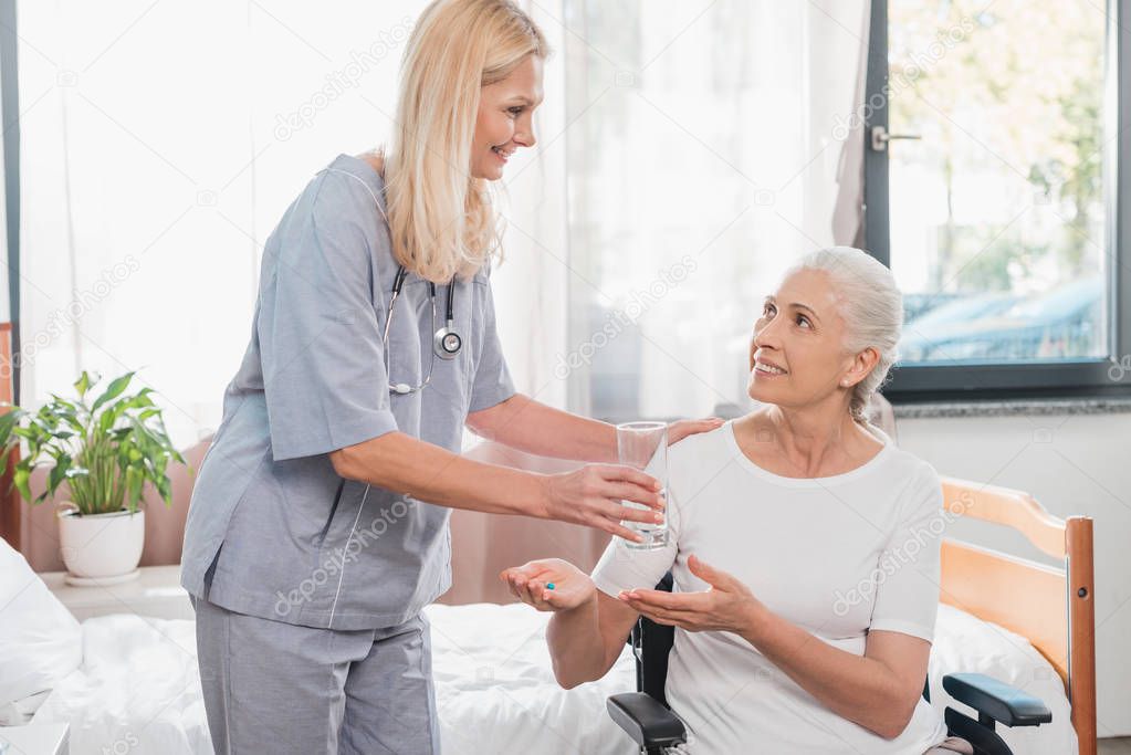 nurse and senior woman in wheelchair