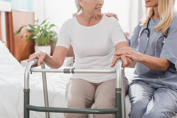 Nurse and senior patient with walker — Stock Photo, Image