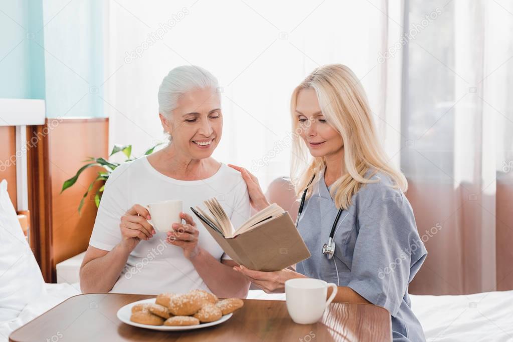 nurse and patient reading book   