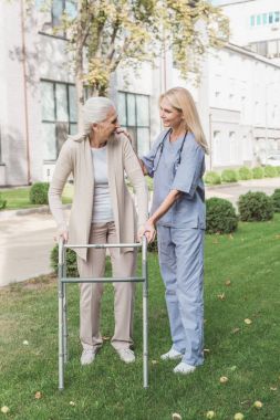 nurse and senior patient with walker clipart