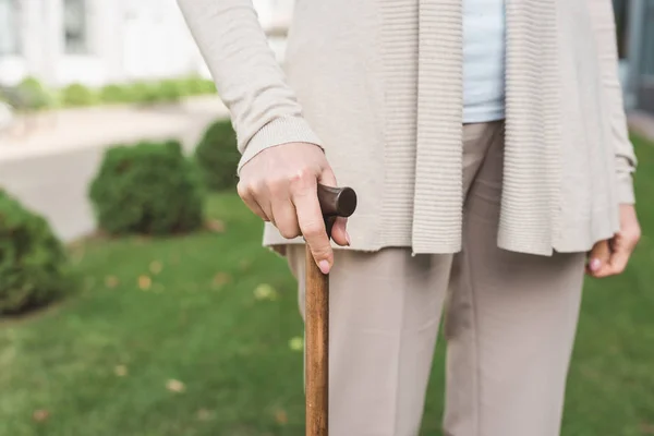 Senior woman with cane — Stock Photo, Image