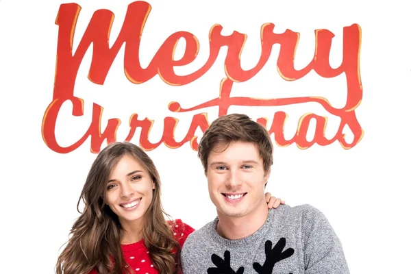 Couple with merry christmas lettering — Free Stock Photo