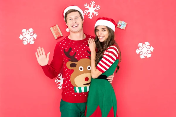 Smiling couple in santa hats — Stock Photo, Image